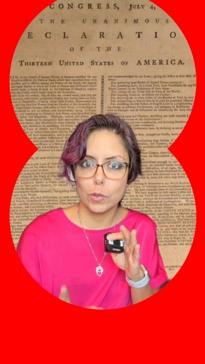 A woman in a pink shirt before the declaration of independence. 