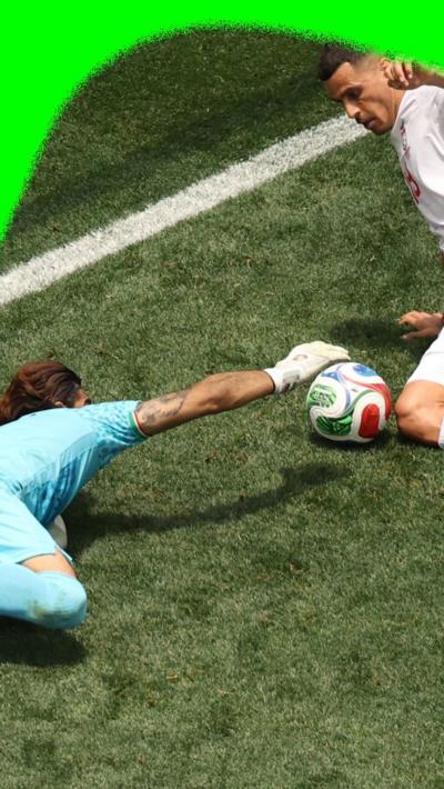Iran's Alireza Beiranvand defends his goal against Belgium