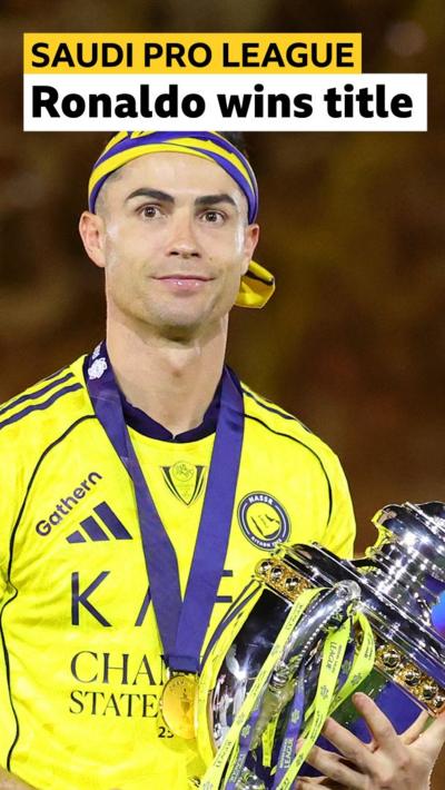 Cristiano Ronaldo holds up Saudi Pro League trophy 
