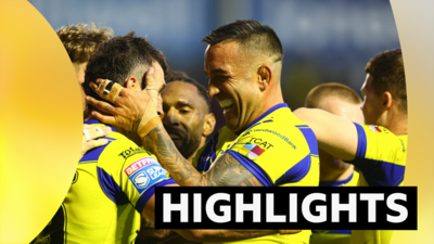 Stefan Ratchford celebrates scoring a try for Warrington