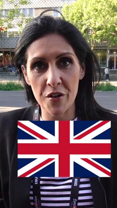 Maryam Moshiri looking at the camera with a Union flag.