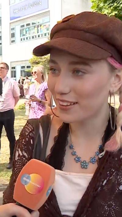 Student wearing brown cap 