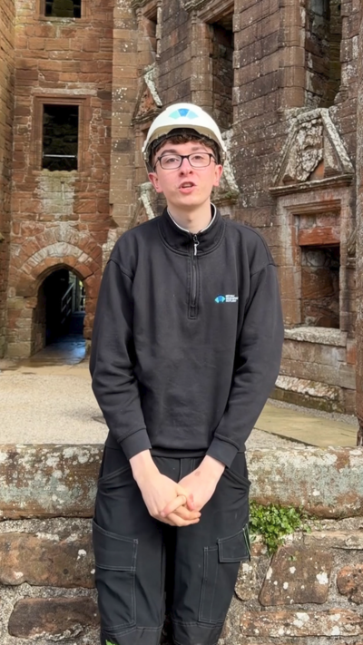 Young man in glasses and a white hard hat.