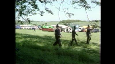 Policemen walk about at Stonehenge