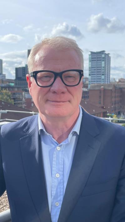 Mayor standing on balcony overlooking Birmingham city centre