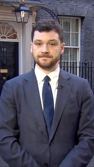 Henry Zeffman stood outside No 10 in a suit