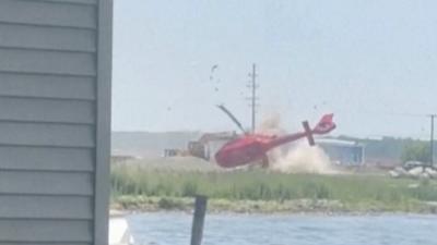 A helicopter flipped and crashed.