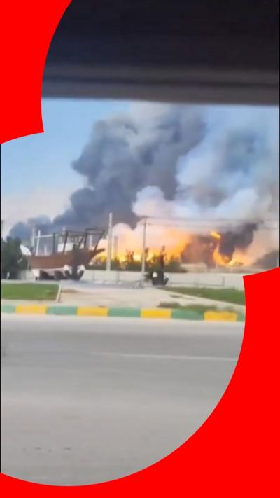 A fire in the distance with smoke rising