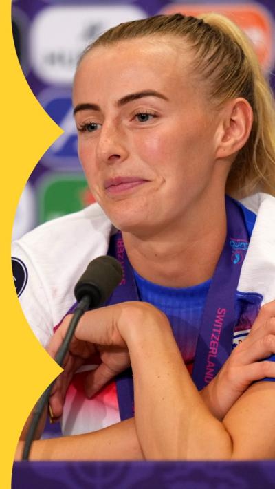 Chloe Kelly, in England kit, smiles during a press conference 