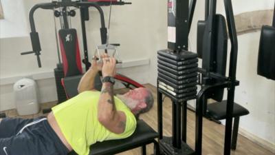 The Reverend Leigh Winsbury works out at his gym in Hatherleigh, Devon