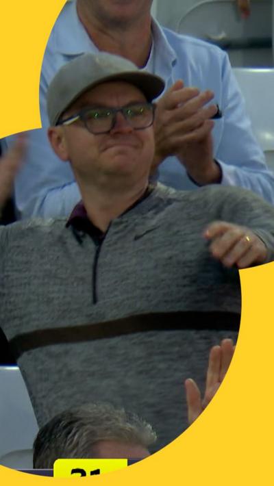 Fan throws the ball after making a crowd catch