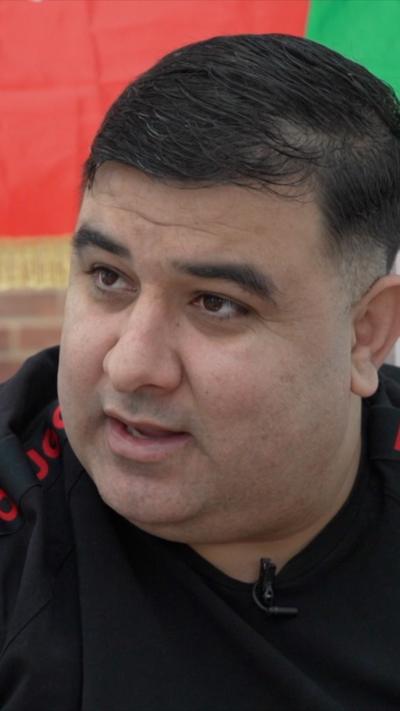 A man in a black t-shirt