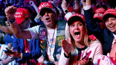 Supporters react as Fox News projects Republican presidential nominee, former U.S. President Donald Trump is elected president during an election night event at the Palm Beach Convention Center on November 06, 2024 in West Palm Beach, Florida. 