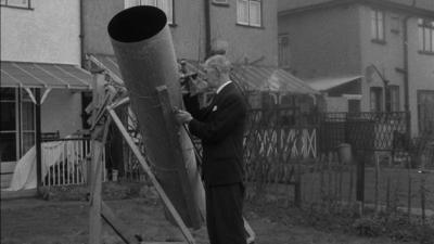 Dr Wilkins using his homemade telescope.