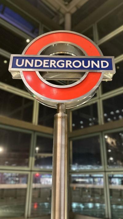 A red and blue London Underground roundel, pictured at King's Cross St. Pancras Underground Station