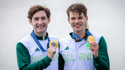 Paul O'Donovan and Fintan McCarthy show off their gold medals after retaining their Olympic rowing lightweight double sculls title