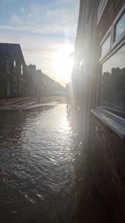 Burst water main and flooded street