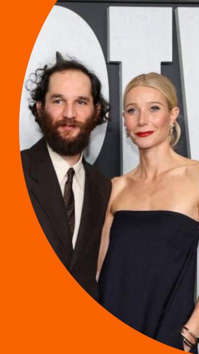Josh Safdie and Gwyneth Paltrow posing together at the Marty Supreme premiere