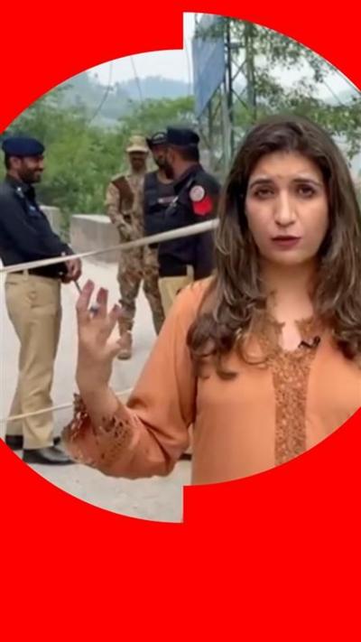 Farhat Javed stood in front of soldiers