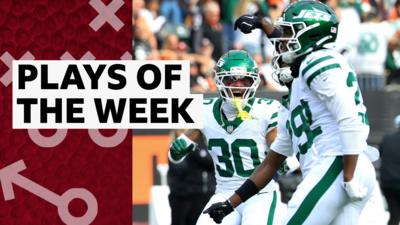 New York Jets players celebrate their first win of the season
