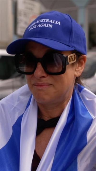 woman wearing a blue cap and shades