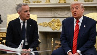 Mark Carney and Donald Trump sitting next to each other in the White House