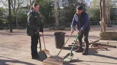 Ricky cleaning up giraffe poo