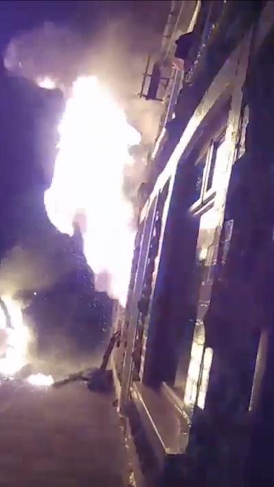 A fire at a house in the night time 