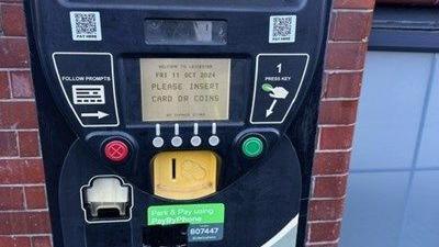 A pay and display machine with fake QR codes