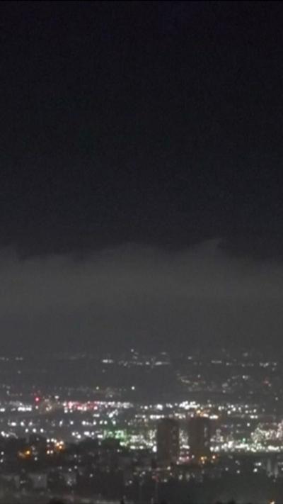 Haifa skyline at night. City lights go into the distance.