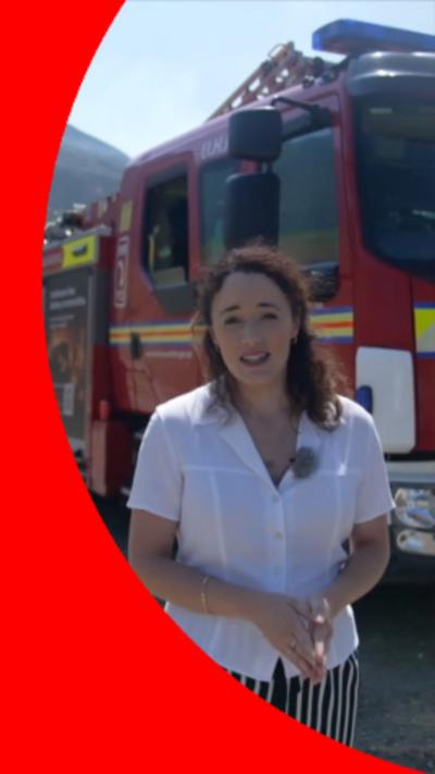Lauren Moss stood next to a fire engine