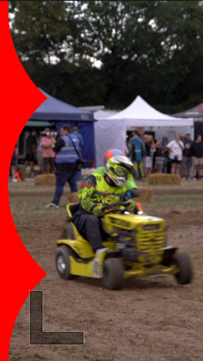 Lawn mower racers on track, with crash helmet and goggles on