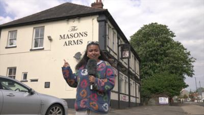 BBC reporter Lena-Zaharah Mohammed stands outside the Mason Arms 