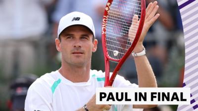 Tommy Paul hits his racket with his hand