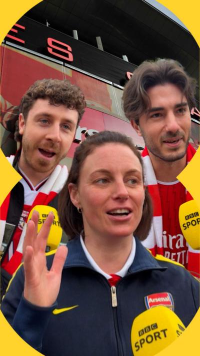 Two men and one woman talk into BBC sport microphones