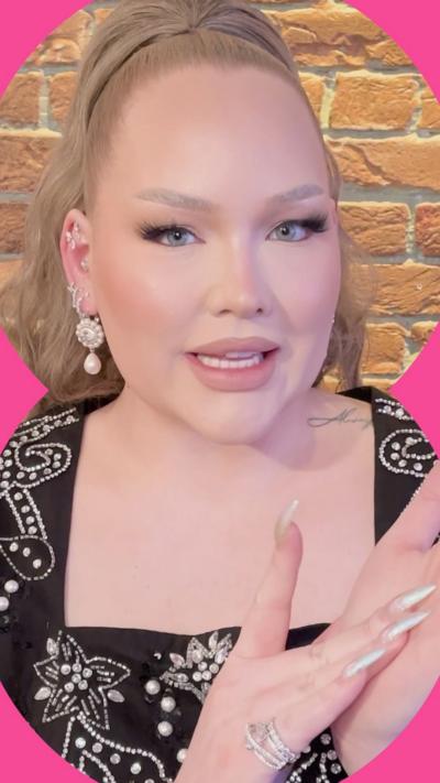 NikkieTutorials demonstrates how to use glitter on her manicured hand