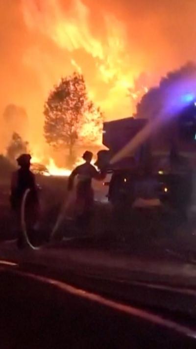 Firefighters fight intense flames