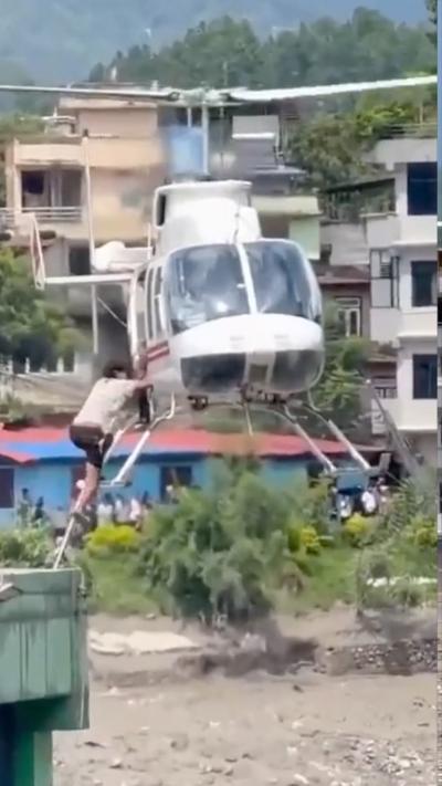 Man climbing into a helicopter