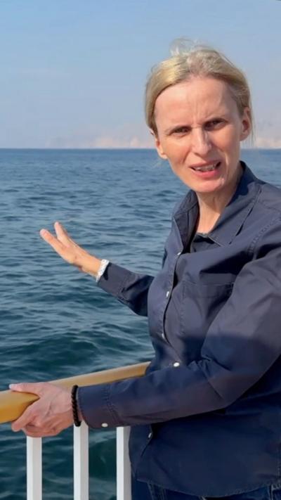 Orla Guerin appearing on the deck of a boat, looking out over the Strait of Hormuz 