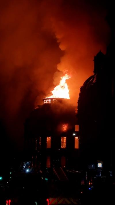 Large flames emitting from collapsed dome on Union Street