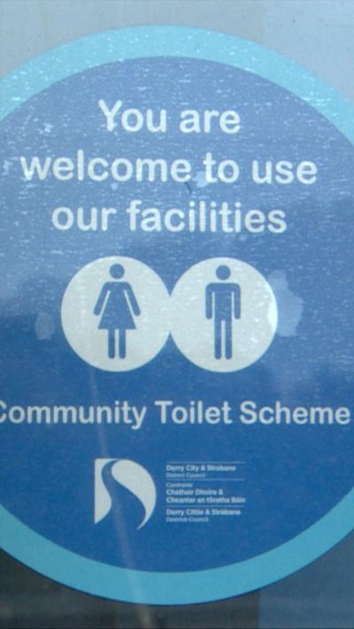A blue circle sticker which states You are welcome to use our facilities 