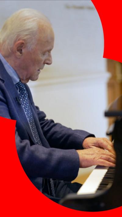 Sir Anthony Hopkins sat at a piano