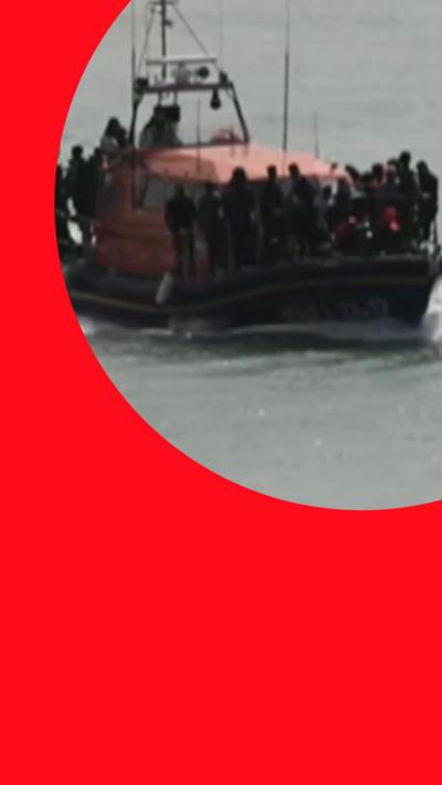 A small boat with dozens of people on