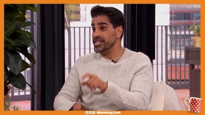 Dr Ranj sat in the Morning Live studio wearing a grey jumper