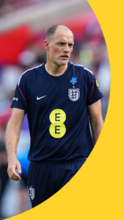 Thomas Tuchel is wearing a blue England training shirt