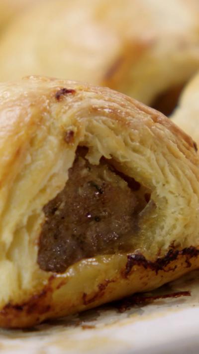 A close up of the middle of a sausage roll. 