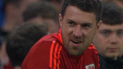 Aaron Ramsey reacts with a smile