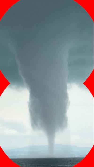 Large waterspout above a lake