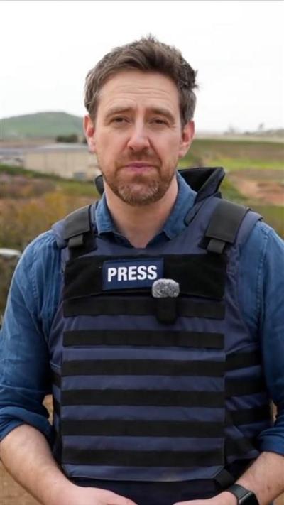 Nick Beake in a press vest in Metula