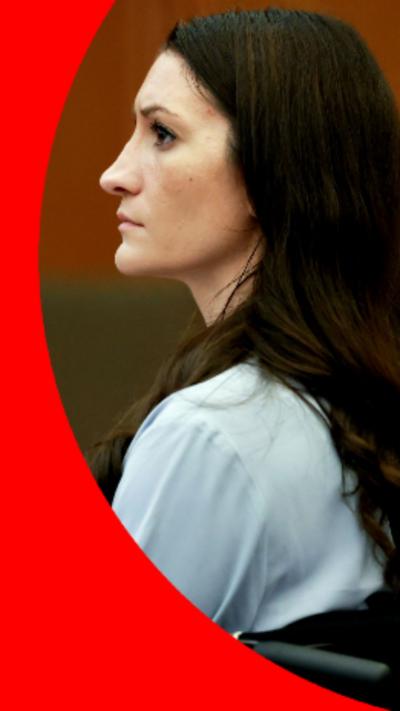 Side profile of Lindsay Clancy who has long dark hair and is wearing a light blue long-sleeved top.